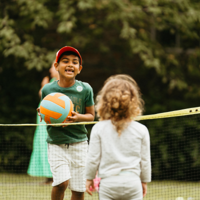 Young children playing a ball game